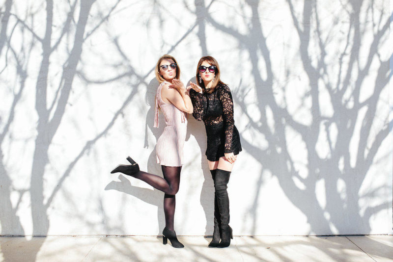 Rock a sexy romper for Valentine's Day. Wesley Shaw from Have a Wesley Day styles a blush romper with a leopard coat and black booties. Blogger Lindsey Lutz from Life Lutzurious styles an Alexis black lace romper with Stuart Weitzman over the knee boots, a leather moto jacket, and Stella McCartney fold over tote.
